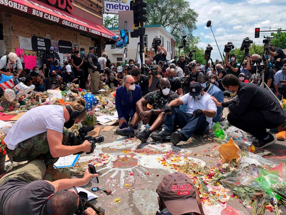 PHOTO: Terrence Floyd, the brother of George Floyd, sits as people gather at the site where George Floyd died on June 1, 2020 in Minneapolis, Minnesota.