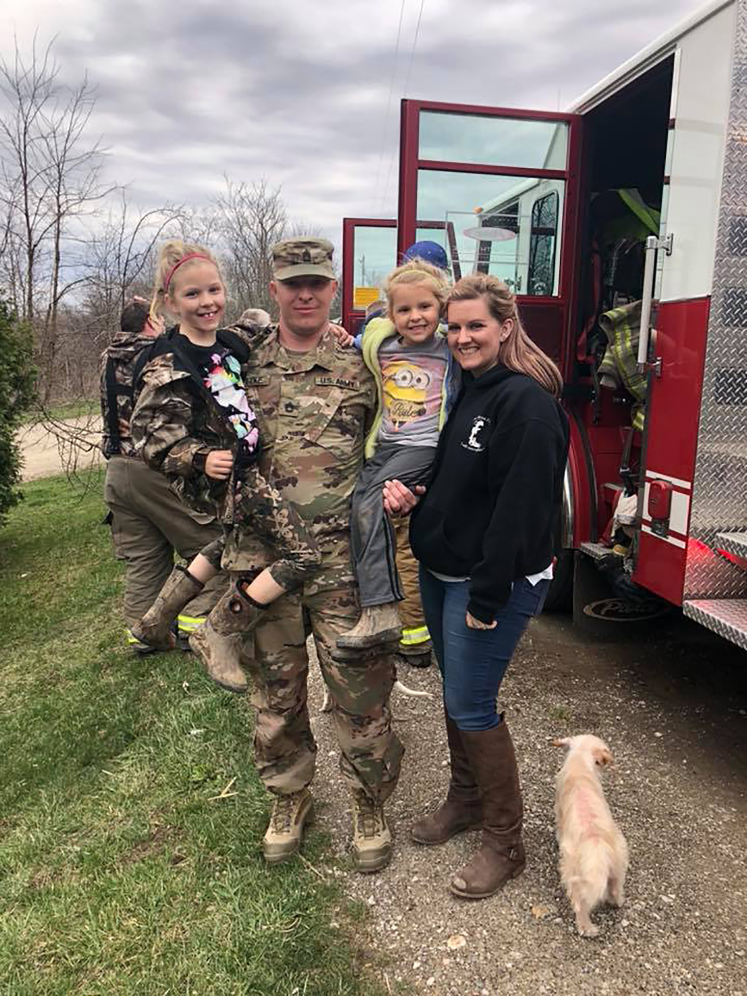 PHOTO: Sgt. First Class Terry Gottke and his wife, Brittany, surprised their daughter with his homecoming Saturday. Terry arrived in a firetruck because he is a firefighter.