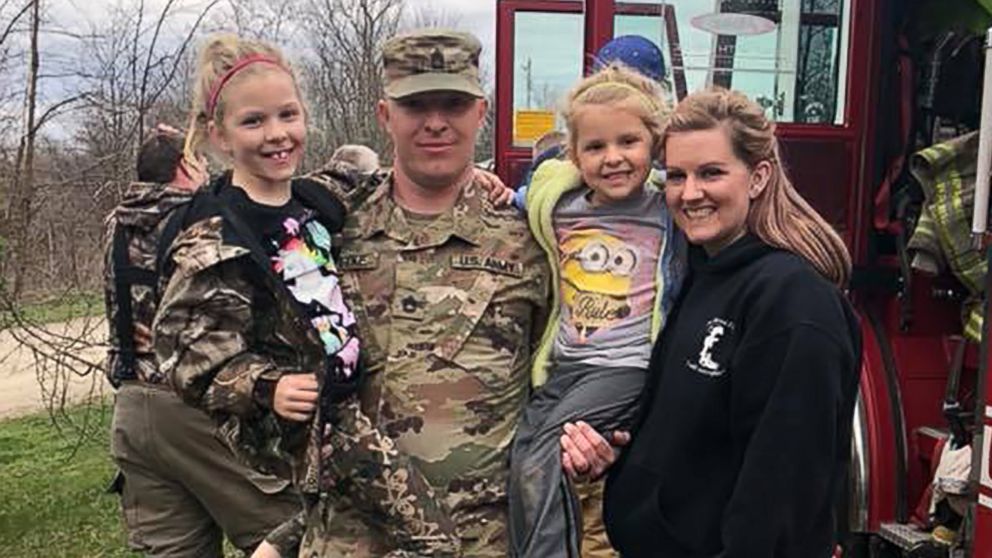 PHOTO: Sgt. First Class Terry Gottke and his wife, Brittany, surprised their daughter with his homecoming Saturday. Terry arrived in a firetruck because he is a firefighter.