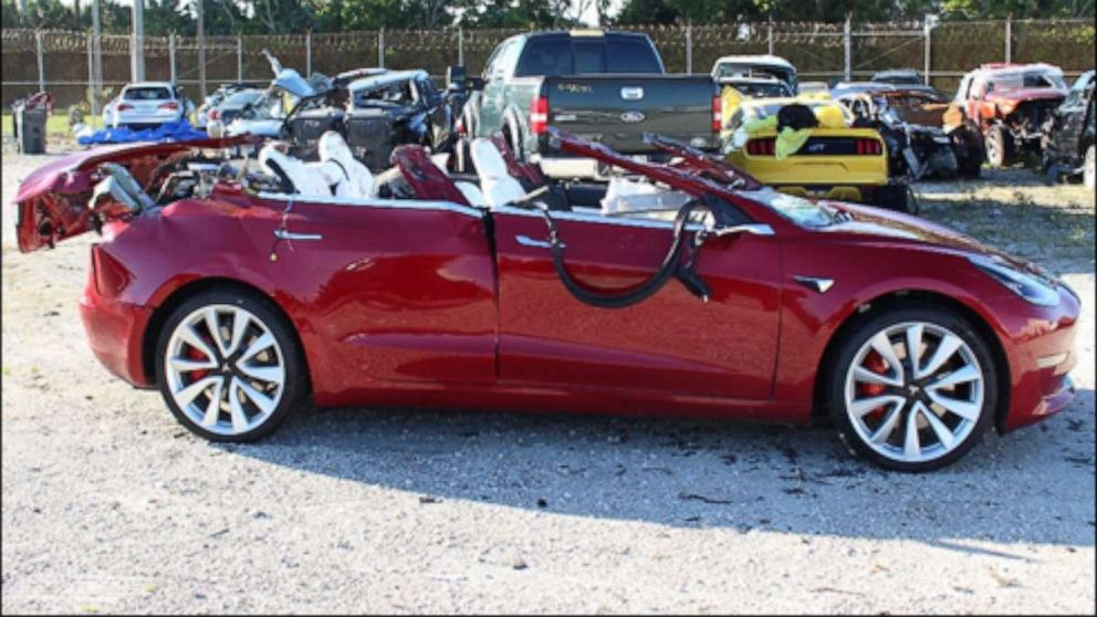 PHOTO: A Tesla Model 3 with extensive roof damage photographed at a tow yard after Jeremy Banner crashed while in autopilot mode in Palm Beach County, Florida, on March 1, 2019.