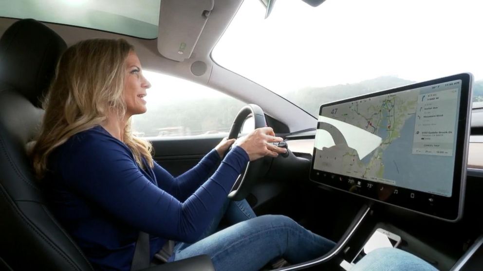PHOTO: ABC News' Becky Worley test-drives the Tesla Model 3, which is the company's first foray into mass-market cars. 
