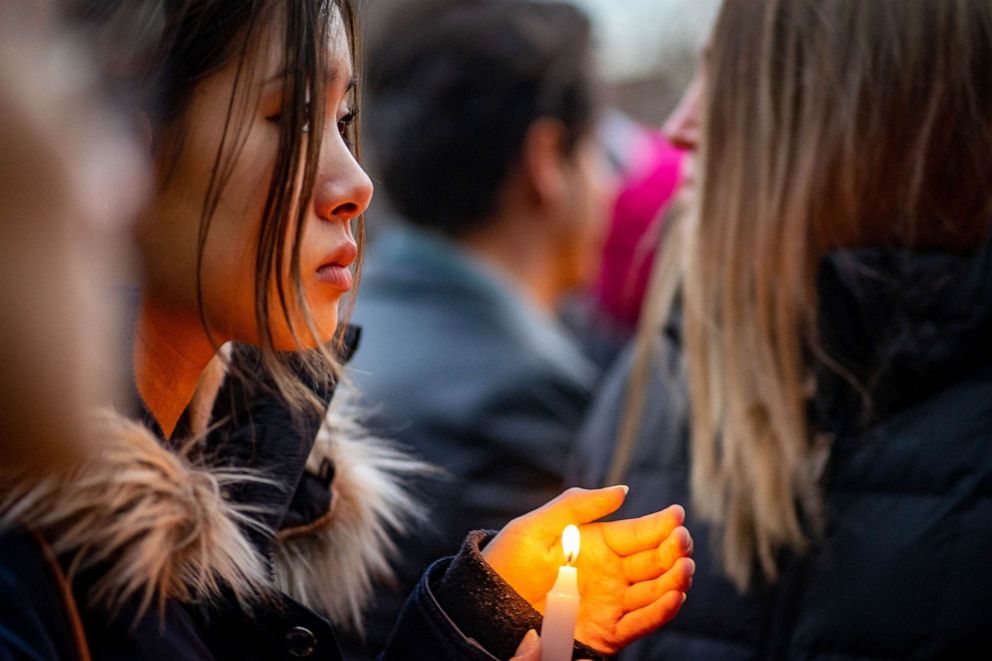 PHOTO: People attend a candlelight vigil held for a murdered Barnard College student Tessa Majors, Dec. 15, 2019, in New York. 