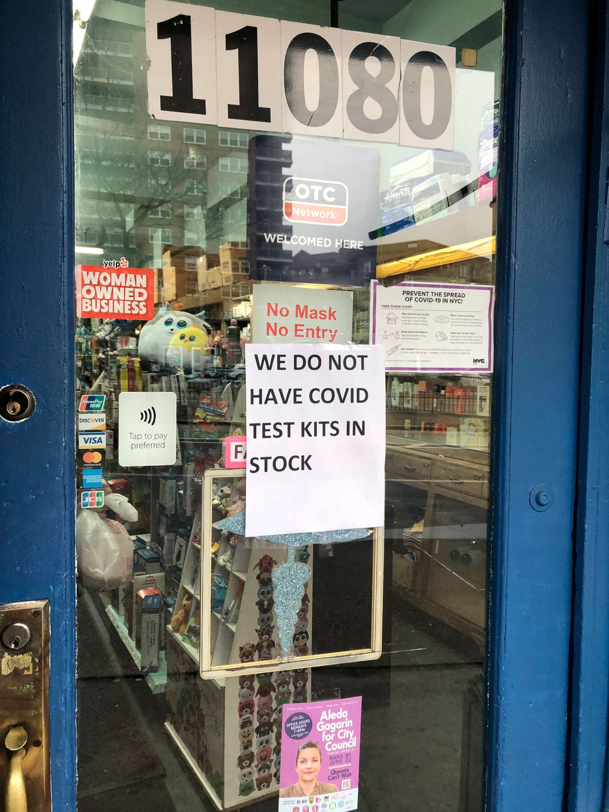 PHOTO: In this Dec. 29, 2021, file photo, a pharmacy in Queens, N.Y., has posted a sign on the door that they have run out of COVID-19 tests.