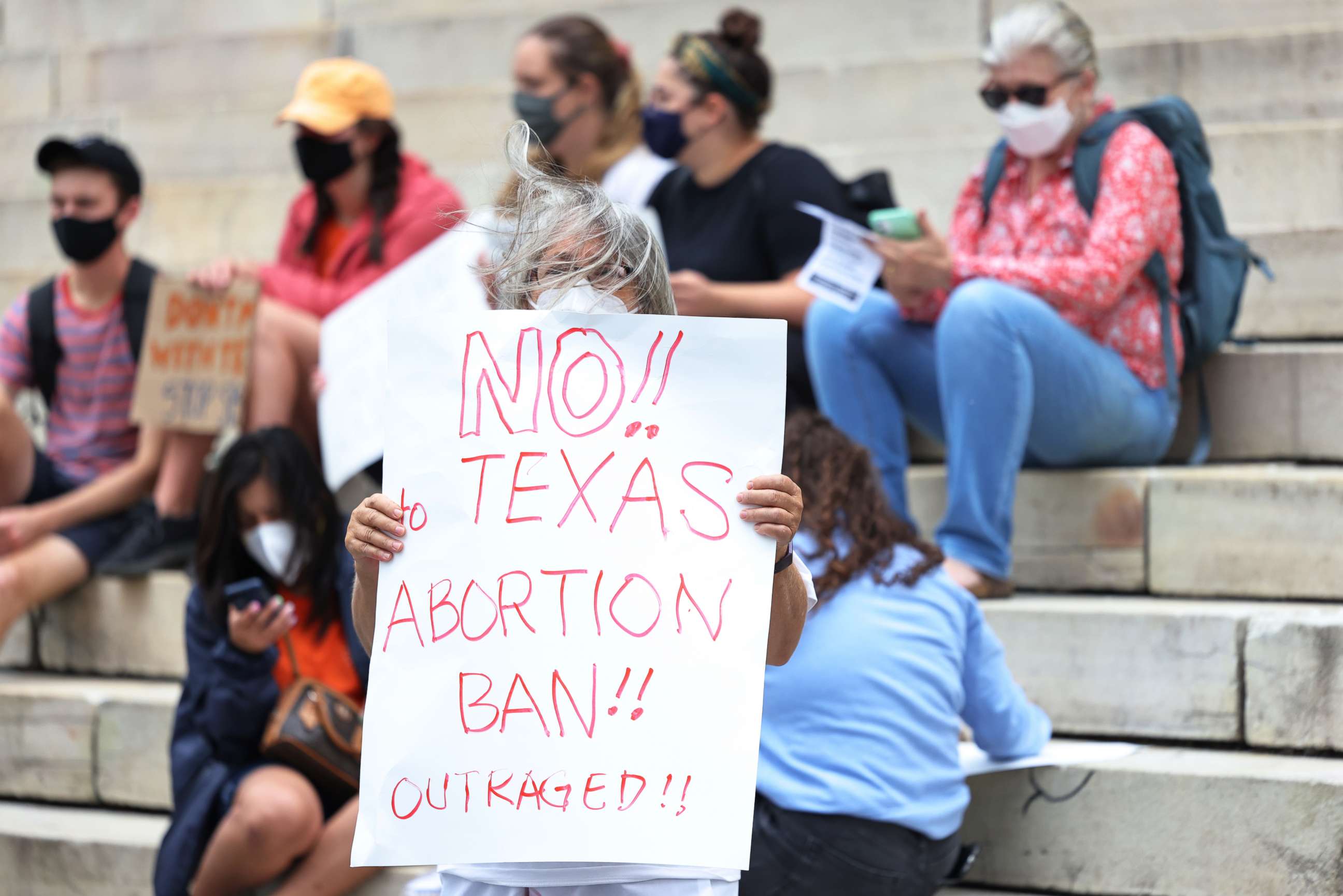 PHOTO: Debra Sweet holds up a sign as she joins people gathered for a reproductive rights rally at Brooklyn Borough Hall on Sept. 1, 2021, in New York City.