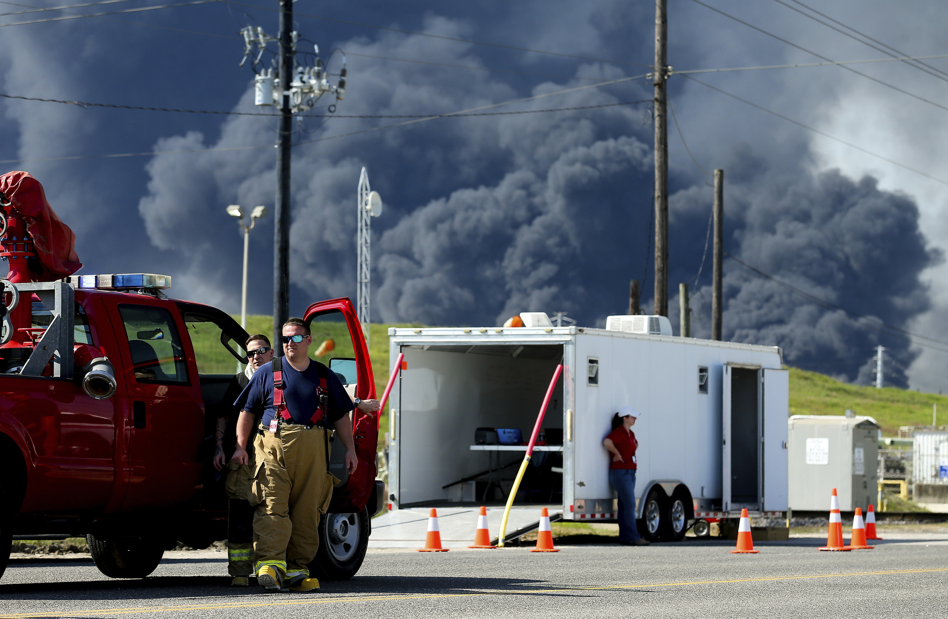 PHOTO: Firefighters arrive at the site where the Intercontinental Terminals Company petrochemical fire reignited, Friday, March 22, 2019, in Deer Park, Texas.