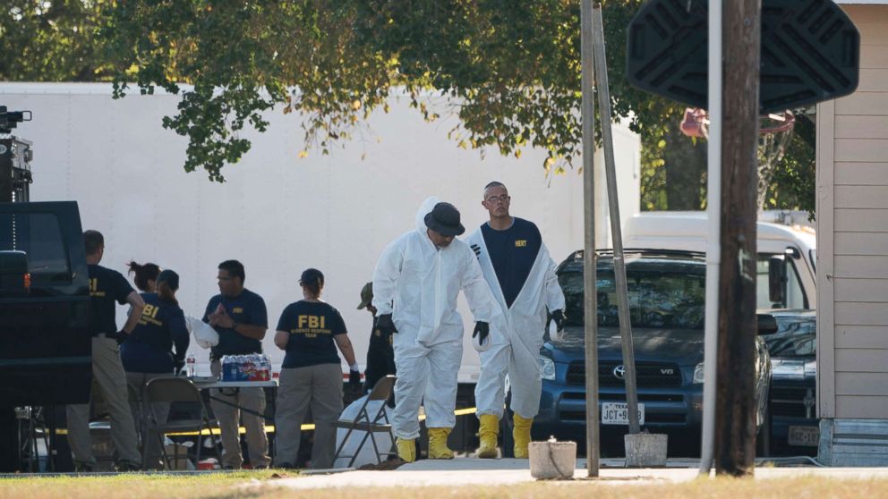 PHOTO: Members of the FBI walk behind the First Baptist Church of Sutherland Springs after a fatal shooting, Nov. 5, 2017, in Sutherland Springs, Texas.