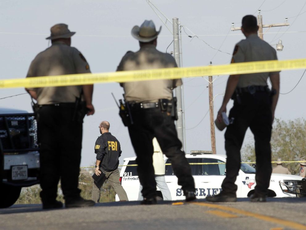 PHOTO: Law enforcement officials gather near the First Baptist Church following a shooting on Nov. 5, 2017 in Sutherland Springs, Texas.