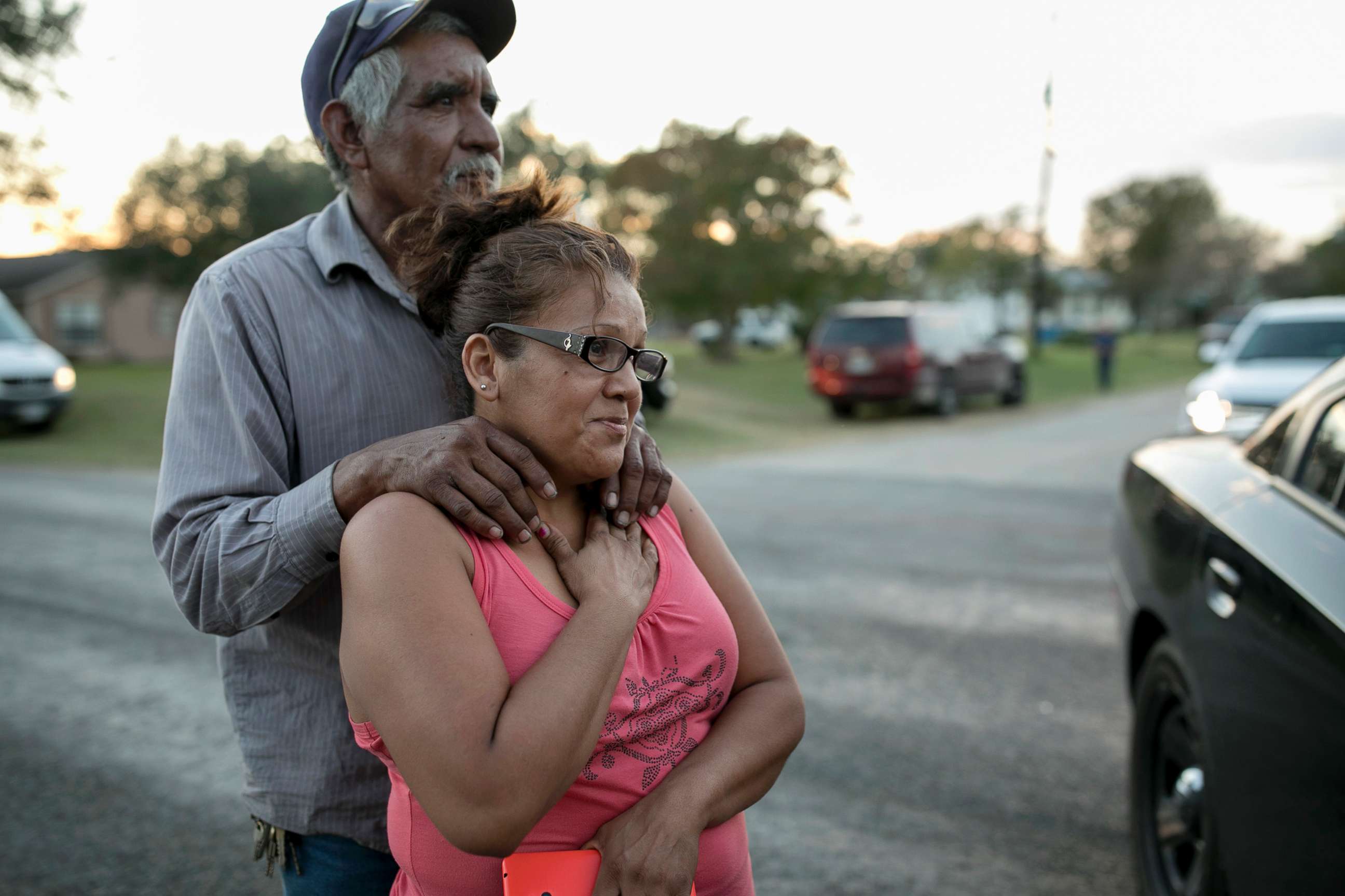 PHOTO: Enrique and Gabby Garcia watch investigators at the scene of a mass shooting at the First Baptist Church in Sutherland Springs, Texas, Nov. 5, 2017.