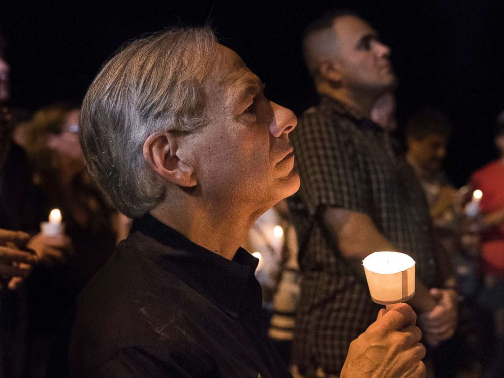 PHOTO: Texas Gov. Greg Abbott participates in a candlelight vigil for the victims of a fatal shooting at the First Baptist Church in Sutherland Springs, Nov. 5, 2017, in Sutherland Springs, Texas.