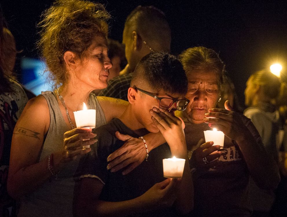 PHOTO: Mona Rodriguez holds her 12-year-old son during a candlelight vigil held for the victims of a fatal shooting at the First Baptist Church of Sutherland Springs, Nov. 5, 2017, in Sutherland Springs, Texas.