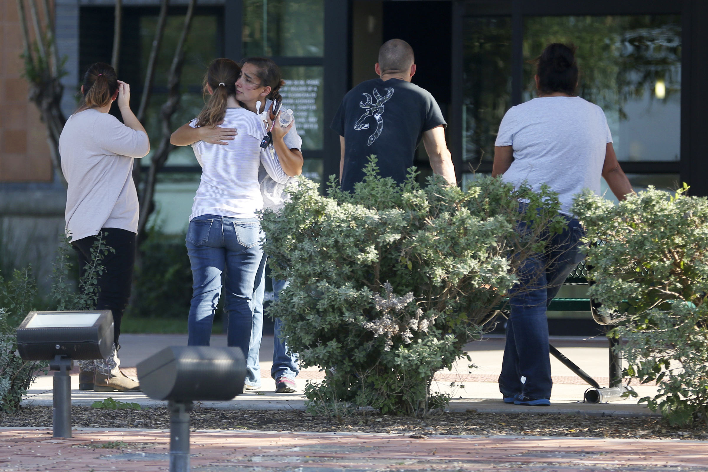 PHOTO: People hug outside Connally Memorial Medical Center in Floresville, Texas,  Nov. 5, 2017.