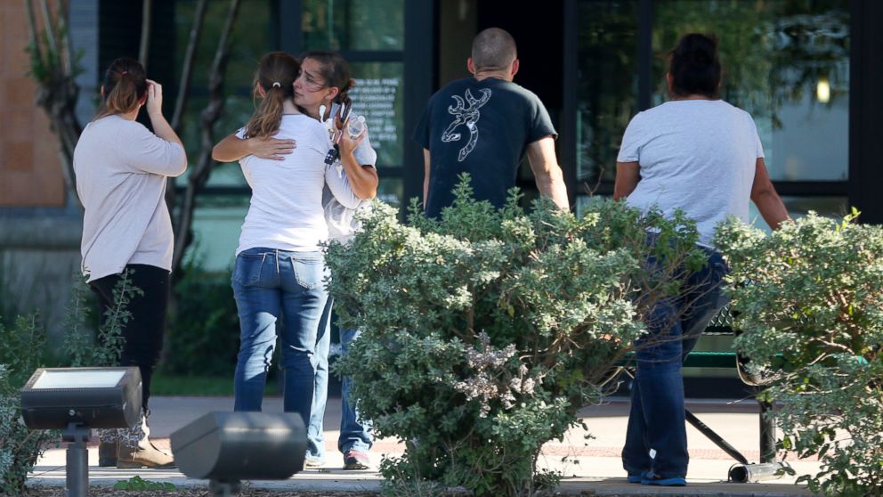 PHOTO: People hug outside Connally Memorial Medical Center in Floresville, Texas,  Nov. 5, 2017.