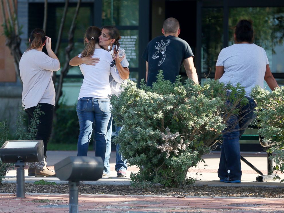 PHOTO: People hug outside Connally Memorial Medical Center in Floresville, Texas, Nov. 5, 2017.