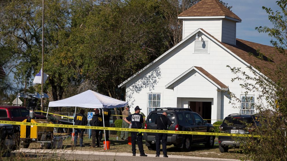 Law enforcement officials works at the scene of a fatal shooting at the First Baptist Church in Sutherland Springs, Texas, Nov. 5, 2017. 