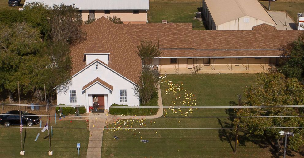 PHOTO: Flags mark evidence on the lawn of the First Baptist Church in Sutherland Springs, Texas, Nov. 6, 2017, a day after the mass shooting. 