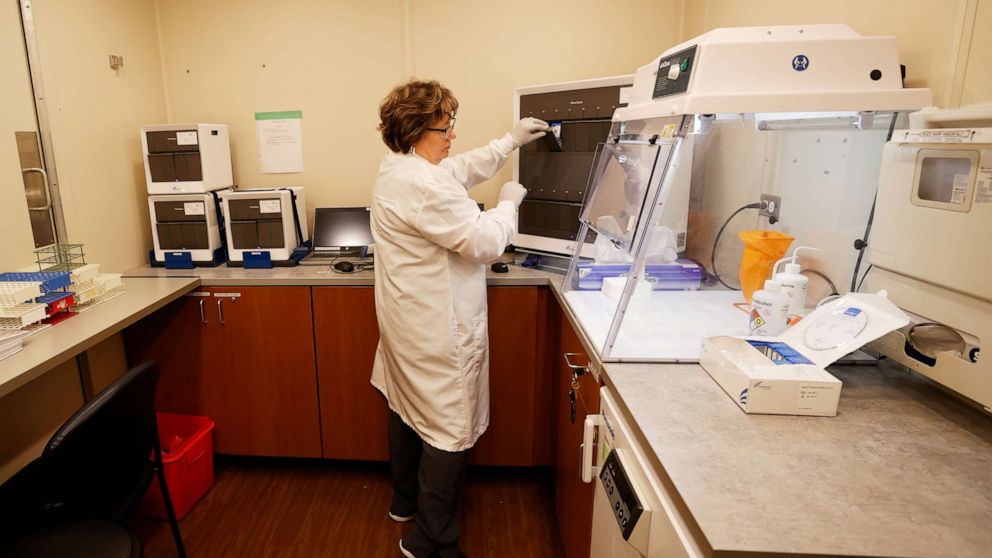 PHOTO: Sanford Health Regulatory Manager Valerie Hieb shows how testing is done at a mobile testing unit, June 9, 2020, in Fort Worth, Texas.