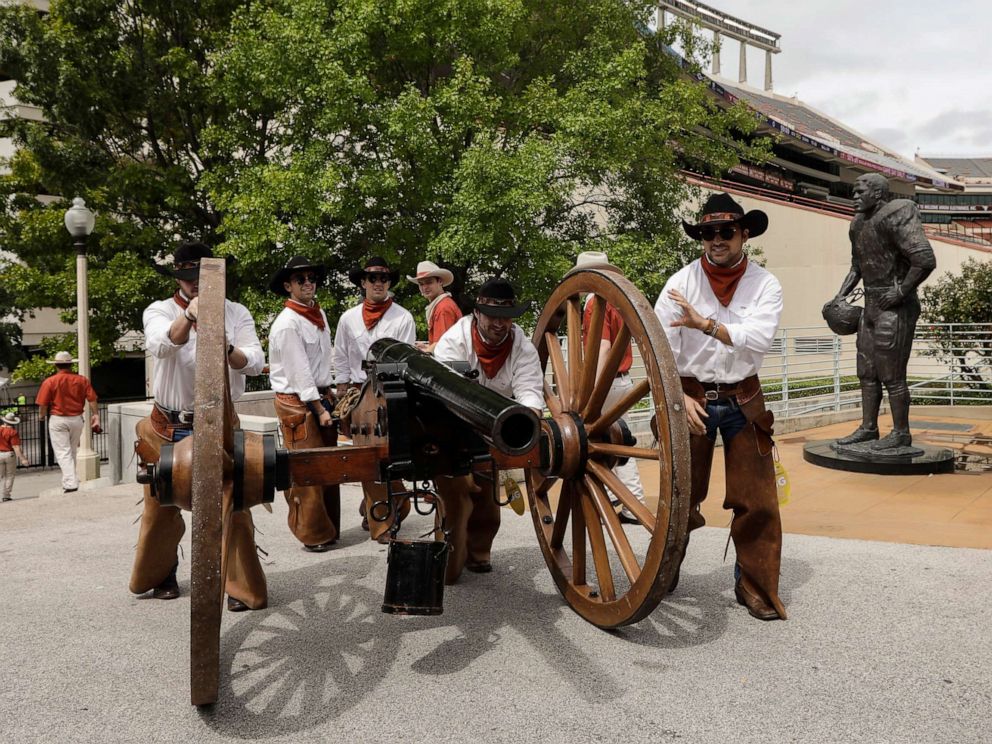 PHOTO: Members of the Texas Cowboys push Smokey the Cannon to the stadium before the game between the Texas Longhorns and the TCU Horned Frogs at Darrell K Royal-Texas Memorial Stadium in this Sept. 22, 2018 file photo in Austin, Texas.