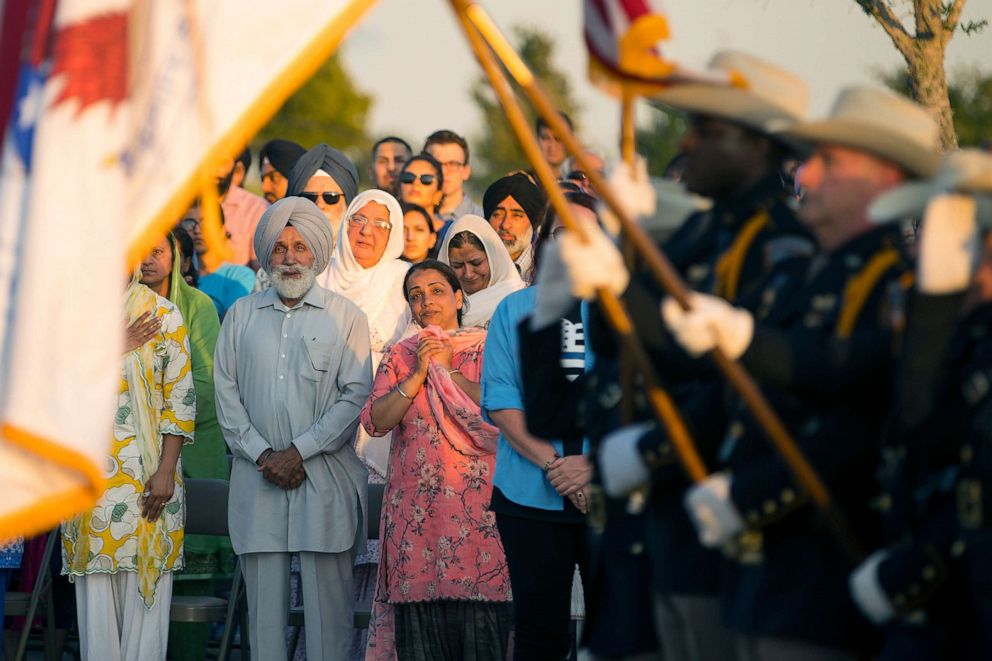 PHOTO: The family of Harris County Deputy Sandeep Dhaliwal watches as an honor guard begins a vigil to honor Dhaliwal in Houston, Texas, Sept. 30, 2019.