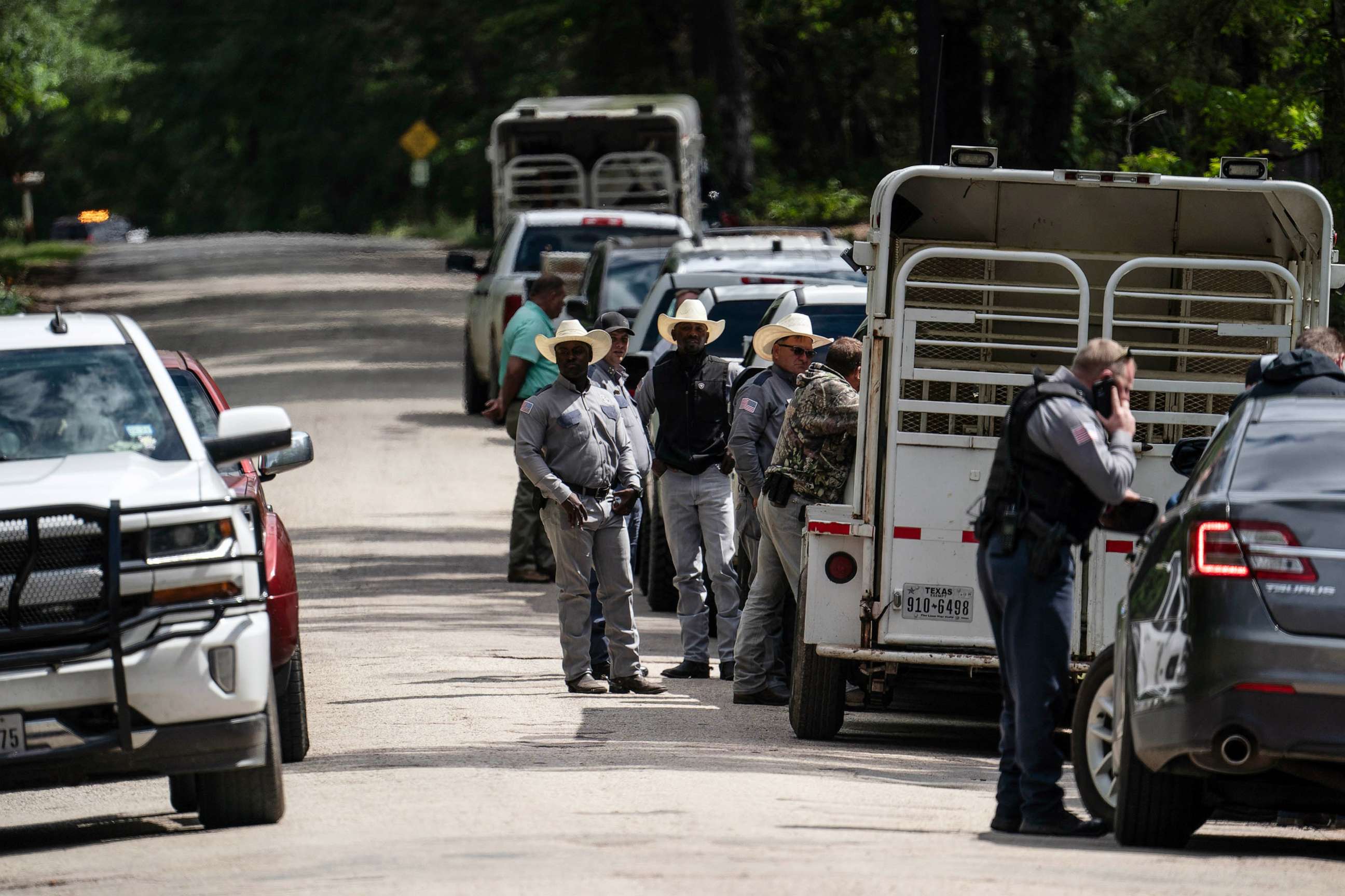 PHOTO: Law enforcement search for the suspect a few miles from the scene where five people, including an 8-year-old child, were killed after a shooting inside a home, April 29, 2023 in Cleveland, Texas.