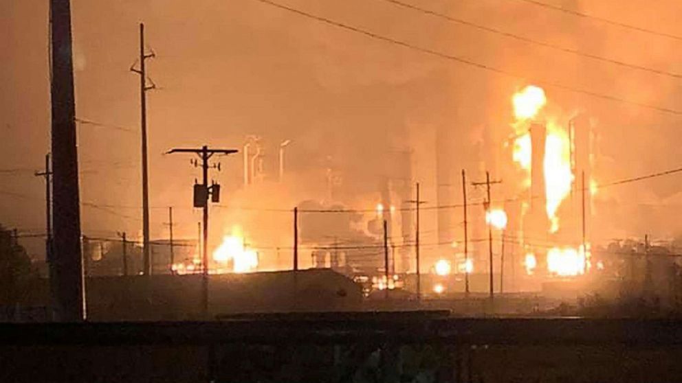 PHOTO: This handout image taken early on November 27, 2019 and released to AFP by Ryan Mathewson shows fire and flames following an explosion at a chemical plant in the Texas city of Port Neches. (Photo by Handout / Courtesy of Ryan Mathewson / AFP)