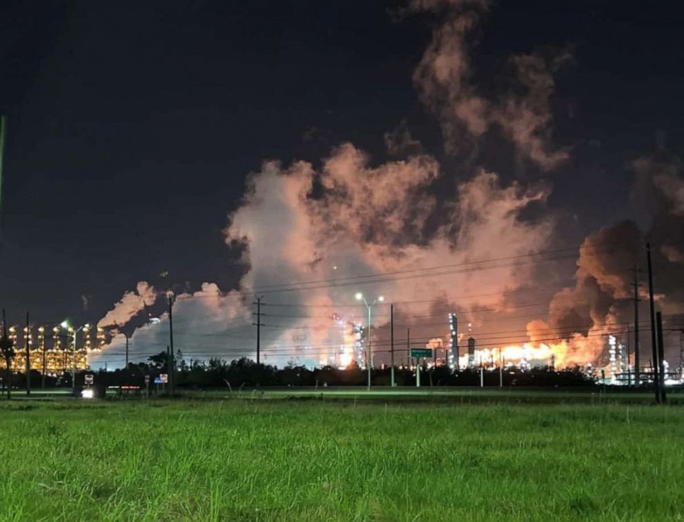 PHOTO: Smoke rises from Exxon Mobil's Baytown plant, about 25 miles east of Houston, following an incident that local sheriffs called a 'major industrial accident,' on Dec. 23, 2021.