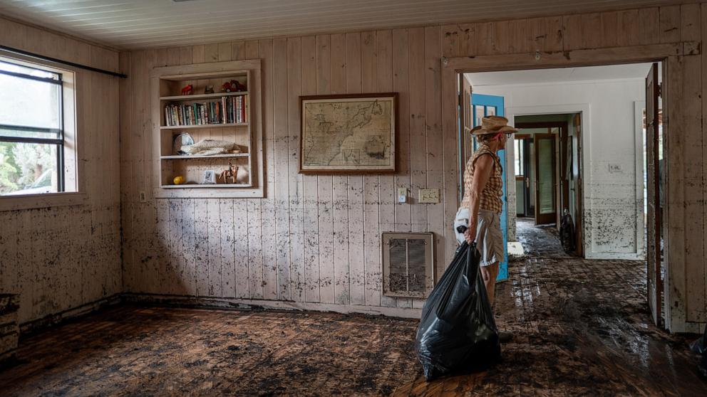 PHOTO: Nancy Callery works to salvage last belongings from her childhood home on July 09, 2025 in Hunt, Texas.