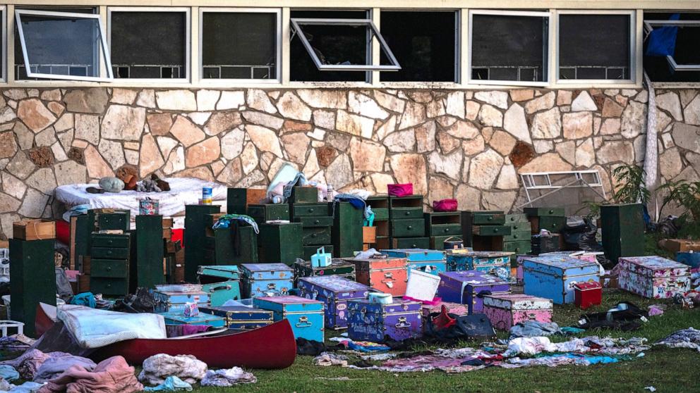 PHOTO: Camper's belongings sit outside one of Camp Mystic's cabins near the Guadalupe River after a flash flood swept through the area, July 7, 2025, in Hunt, Texas.