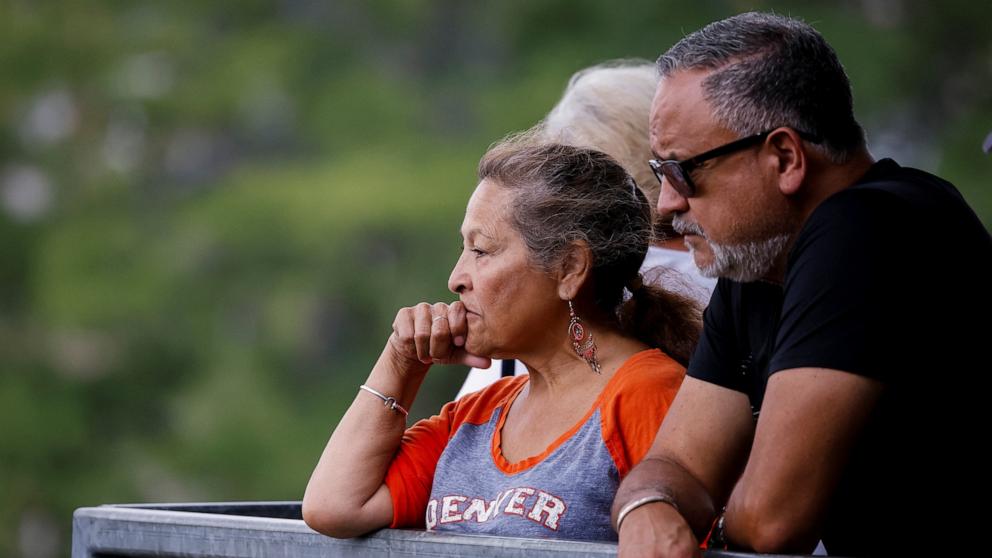 PHOTO: People look at the Guadalupe river, following flash flooding, in Kerrville, Texas, July 6, 2025.