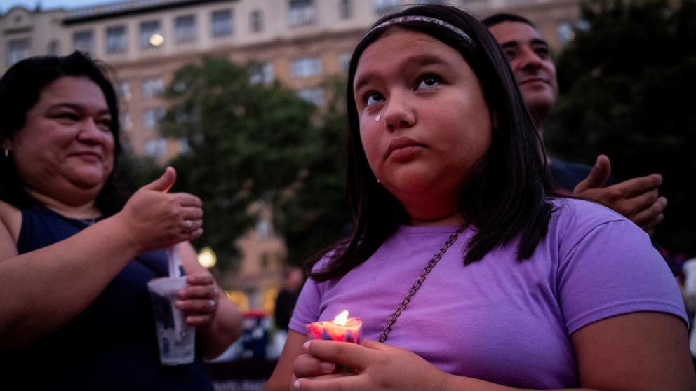 PHOTO: People take part in a vigil in memory of Texas flooding victims, at Travis Park in San Antonio, Texas, July 7, 2025.