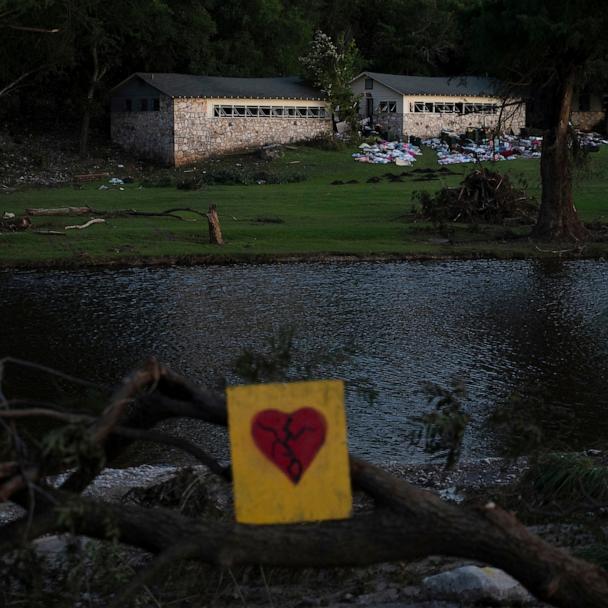 A broken heart sign is displayed near Camp Mystic, July 8, 2025, after a flash flood swept through the area in Hunt, Texas. 
