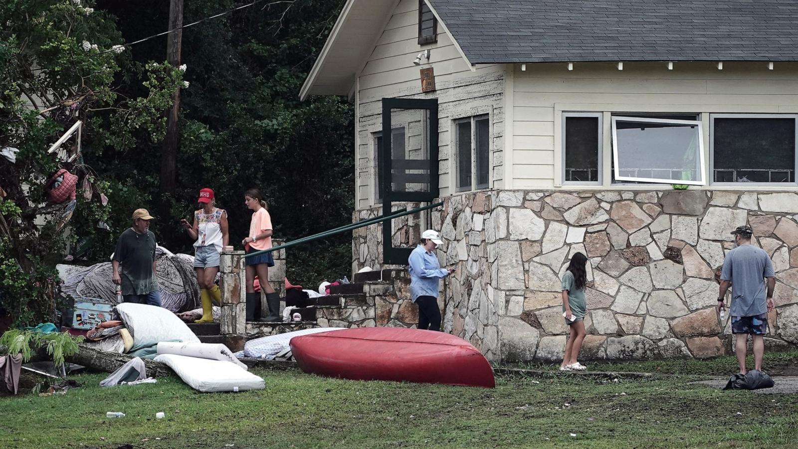 PHOTO: People view damage to cabins at Camp Mystic, in Hunt, Texas, July 6, 2025.