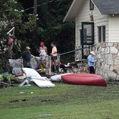 PHOTO: People view damage to cabins at Camp Mystic, in Hunt, Texas, July 6, 2025.