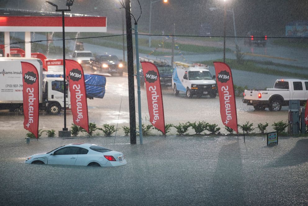 PHOTO: A flooded out car is stranded in high water off U.S. 59 as rain from Tropical Depression Imelda inundated the area on Sept. 19, 2019, near Spendora, Texas.