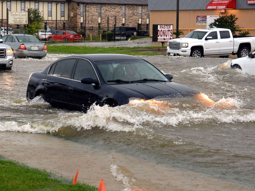 First day of summer brings flooding to Texas, extreme heat in the West