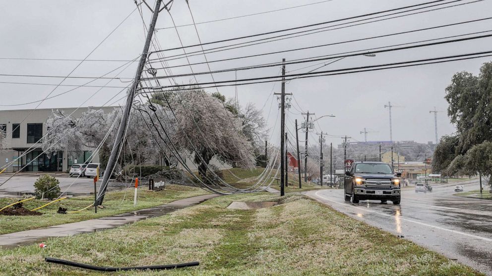 PHOTO: Frozen power lines are seen hanging near a sidewalk, Feb. 1, 2023 in Austin.