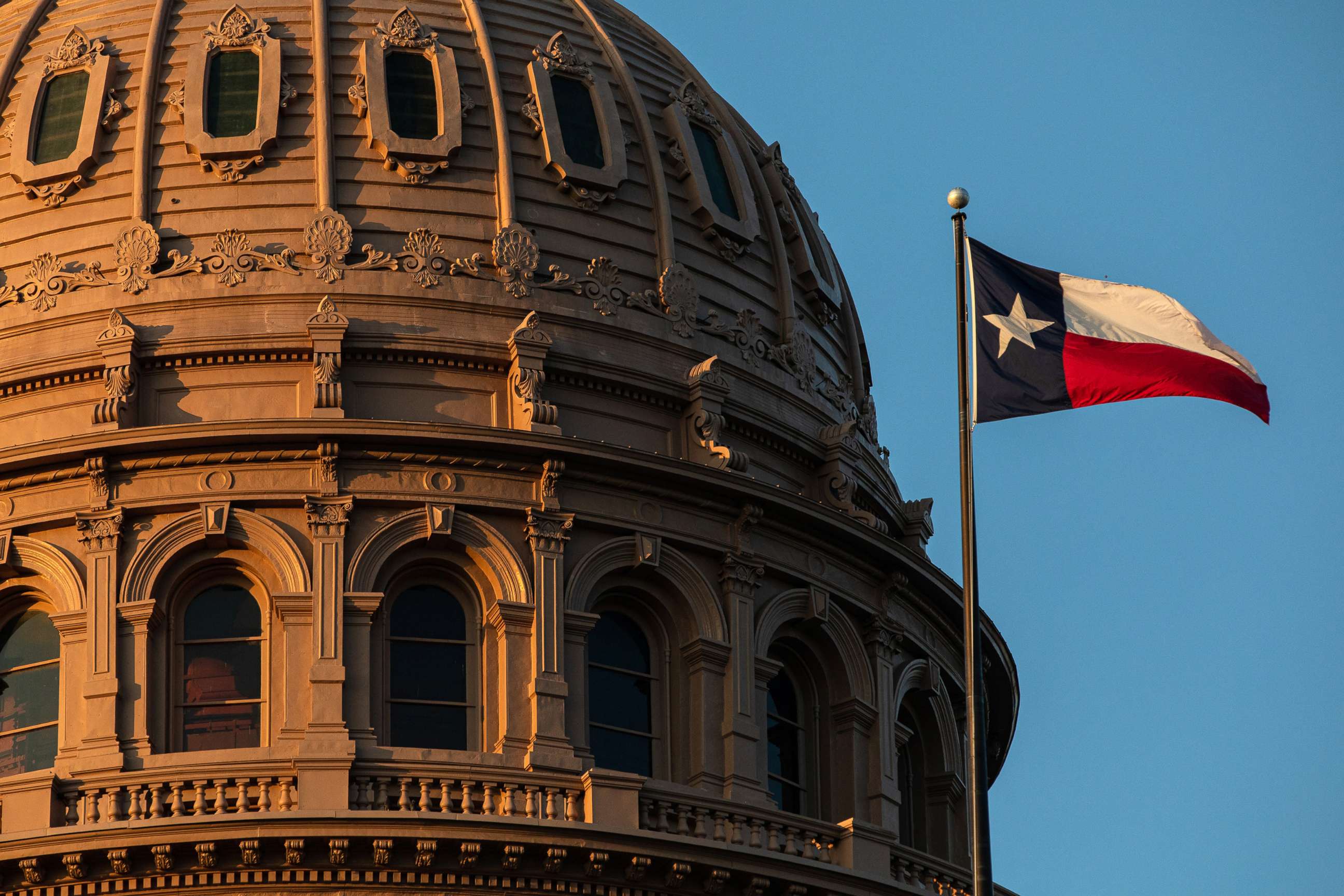 PHOTO: The Texas flag flies over the State Capitol in Austin, Sept. 20, 2021.