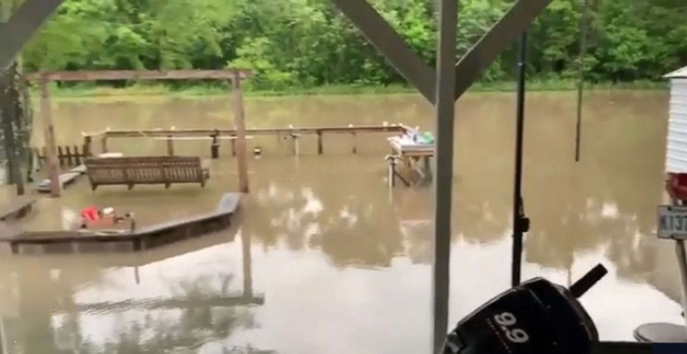 PHOTO: Volunteers try to get flooding under control after a temporary dam failure in Louisiana