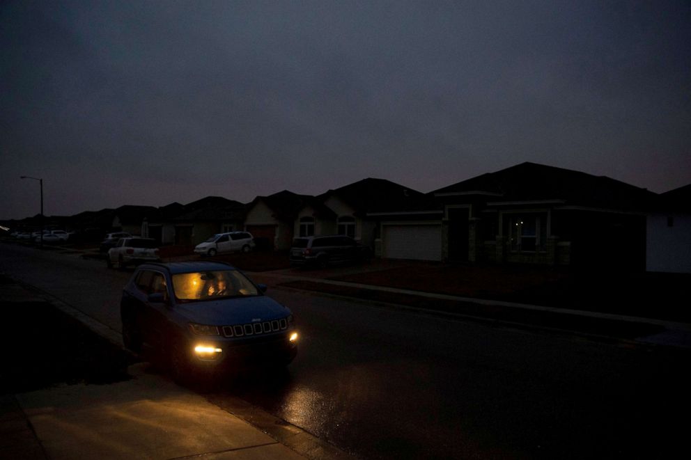 PHOTO: Krystan Hood sits with her two young children inside her heated car after cold weather knocked out power in Corpus Christi, Texas, Feb. 16, 2021.