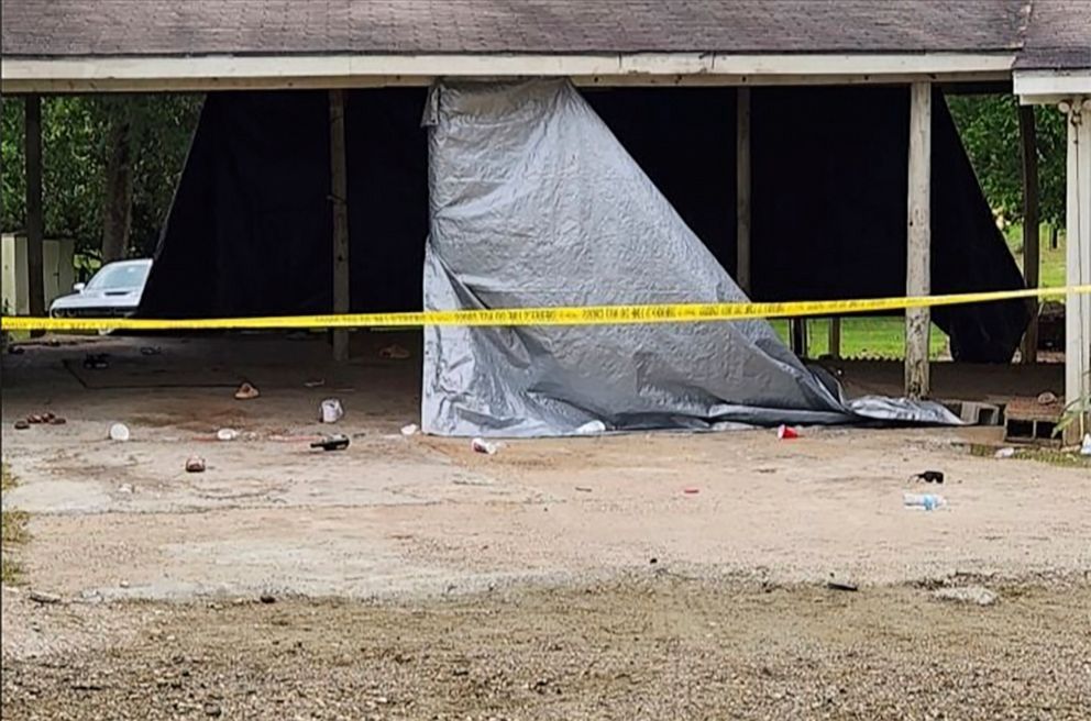 PHOTO: In this photo provided by KJAS, crime scene tape cordons off the scene of a shooting at a prom after-party, April 23, 2023, in Jasper, Texas.