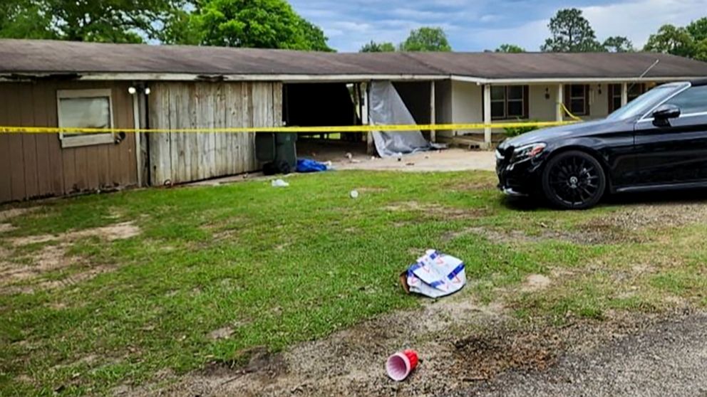 PHOTO: In this photo provided by KJAS, crime scene tape cordons off the scene of a shooting at a prom after-party, April 23, 2023, in Jasper, Texas.