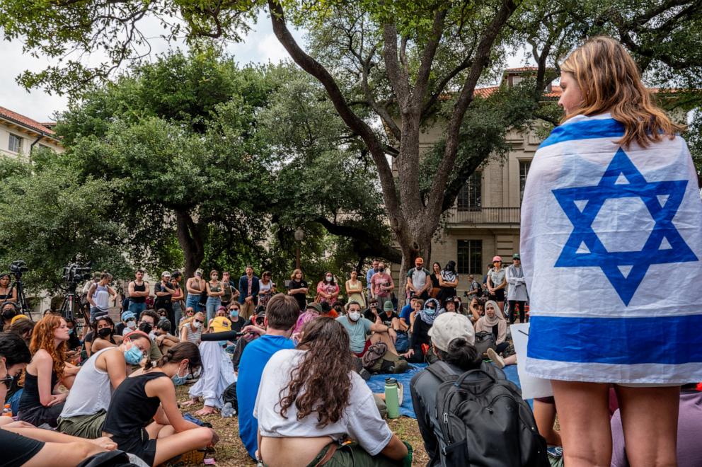 PHOTO: Students listen and take notes during a pro-Palestine educational rally held on campus at the University of Texas at Austin on April 30, 2024 in Austin, Texas. 