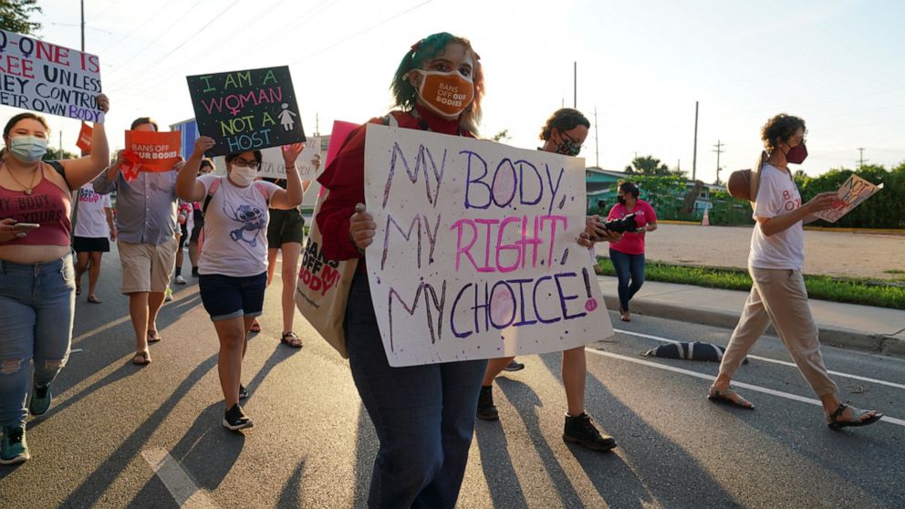 PHOTO: Supporters of reproductive choice take part in the nationwide Women's March, held after Texas rolled out a near-total ban on abortion procedures and access to abortion-inducing medications, in Brownsville, Texas, Oct. 2, 2021.