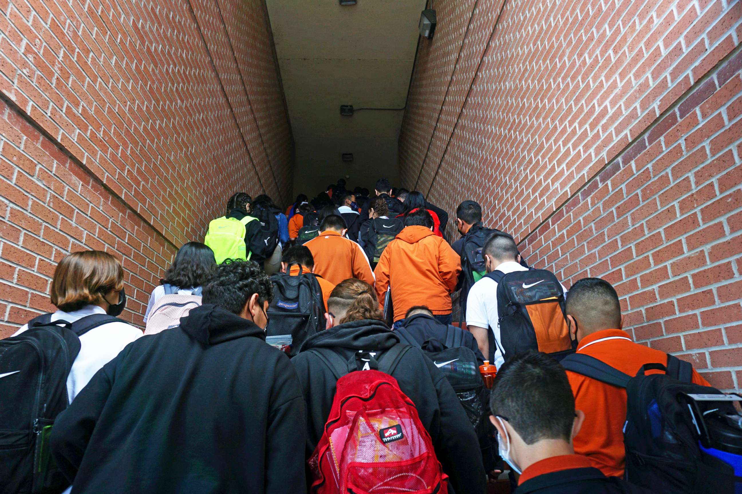 PHOTO: In this Aug. 17, 2021, file photo, students climb stairs to class on campus during their first day back to school at Stillman Middle School in Brownsville, Texas.