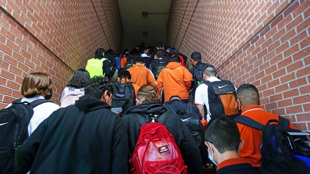 PHOTO: In this Aug. 17, 2021, file photo, students climb stairs to class on campus during their first day back to school at Stillman Middle School in Brownsville, Texas.