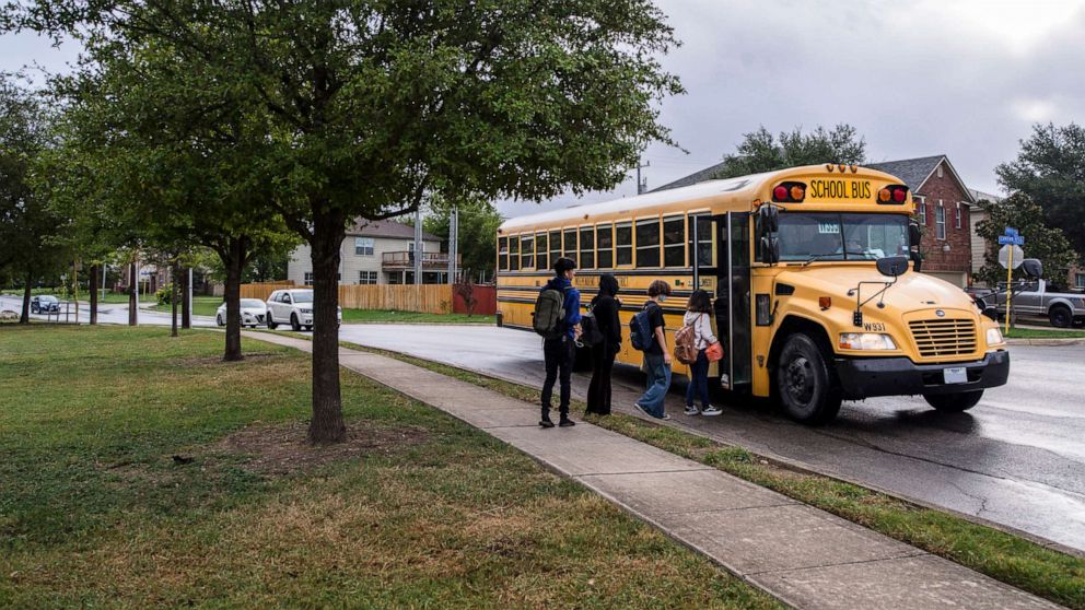 PHOTO: In this Sept. 13, 2021, file photo, a school bus picks up children on the way to school in San Antonio, Texas.