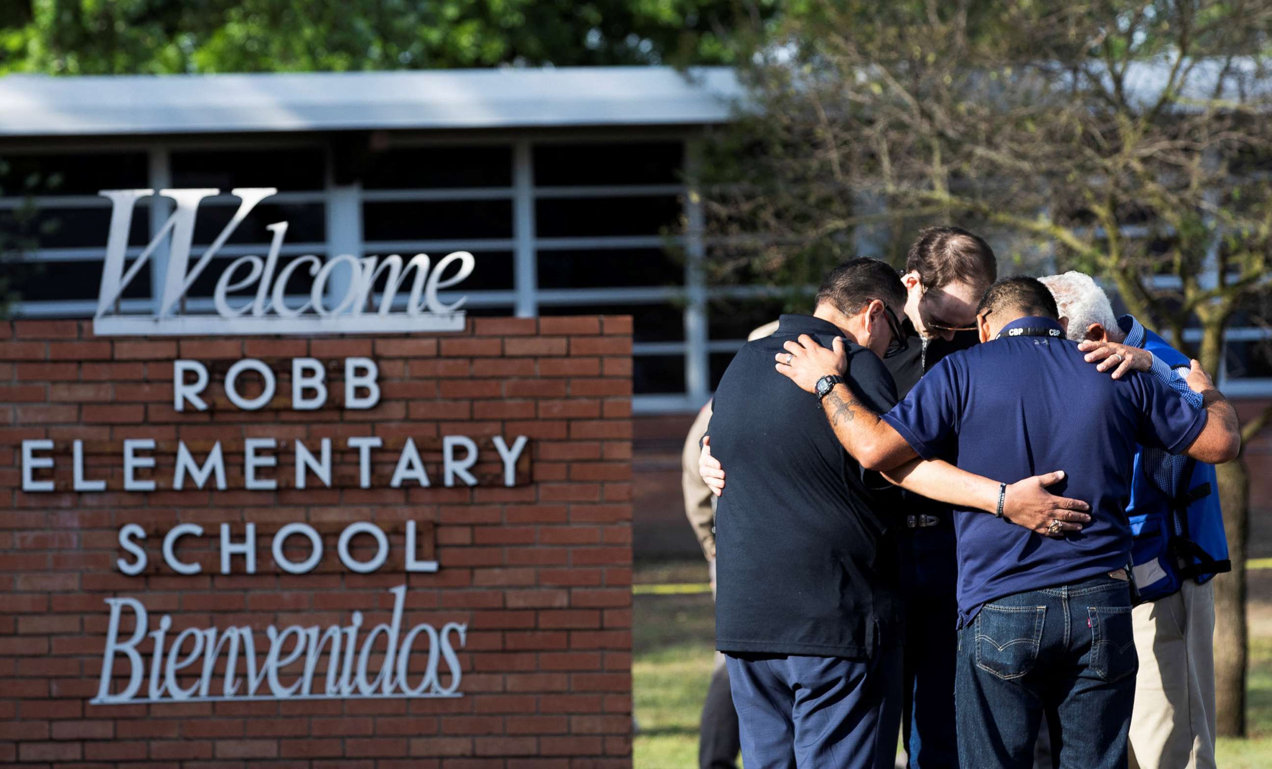 PHOTO: People gather at Robb Elementary School, the scene of a mass shooting in Uvalde, Texas, May 25, 2022.