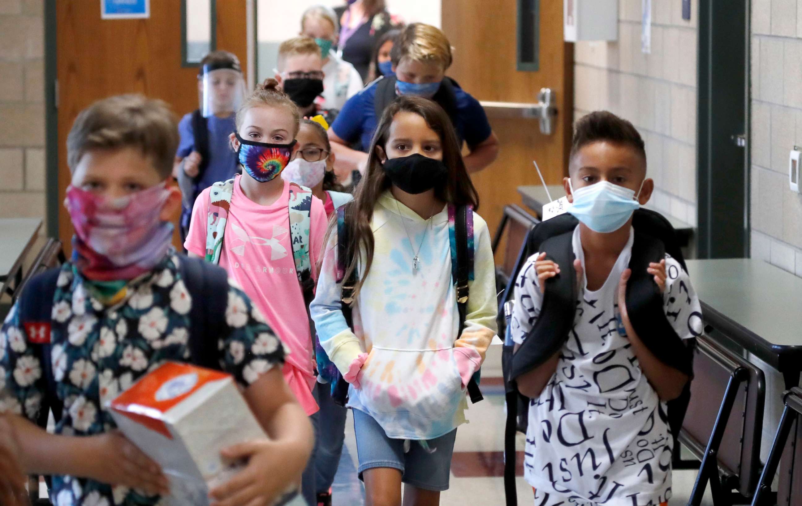 PHOTO: Wearing masks to prevent the spread of COVID19, elementary school students  begin their school day in Godley, Texas, Aug. 5, 2020.