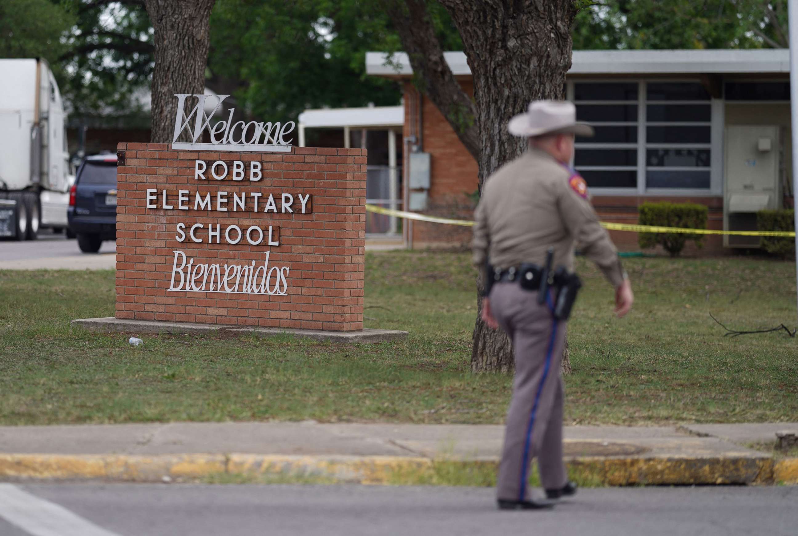 PHOTO: An officer walks outside of Robb Elementary School after a mass shooting occurred in Uvalde, Texas, on May 24, 2022.