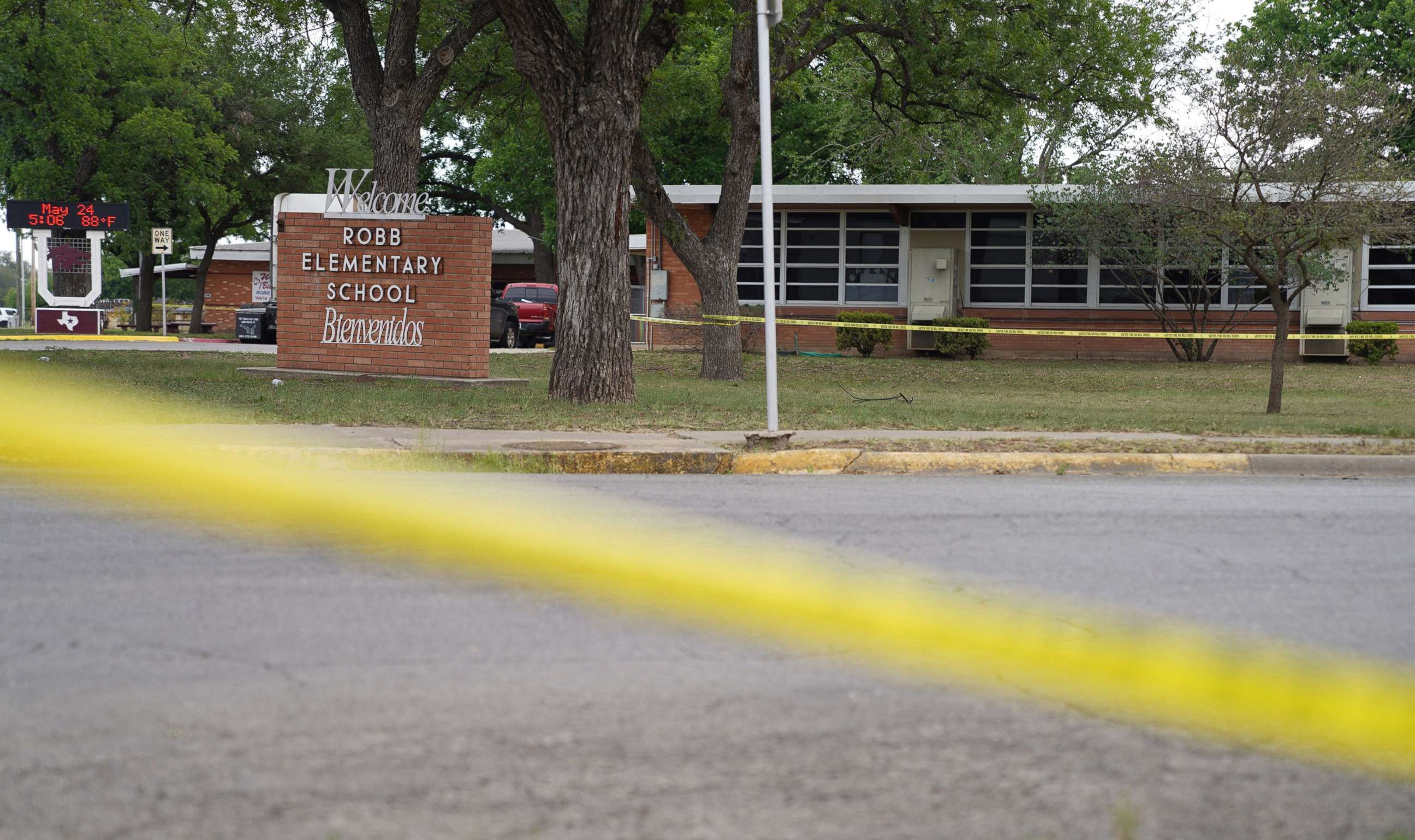 PHOTO: Sheriff crime scene tape is seen outside of Robb Elementary School as State troopers guard the area in Uvalde, Texas, on May 24, 2022.