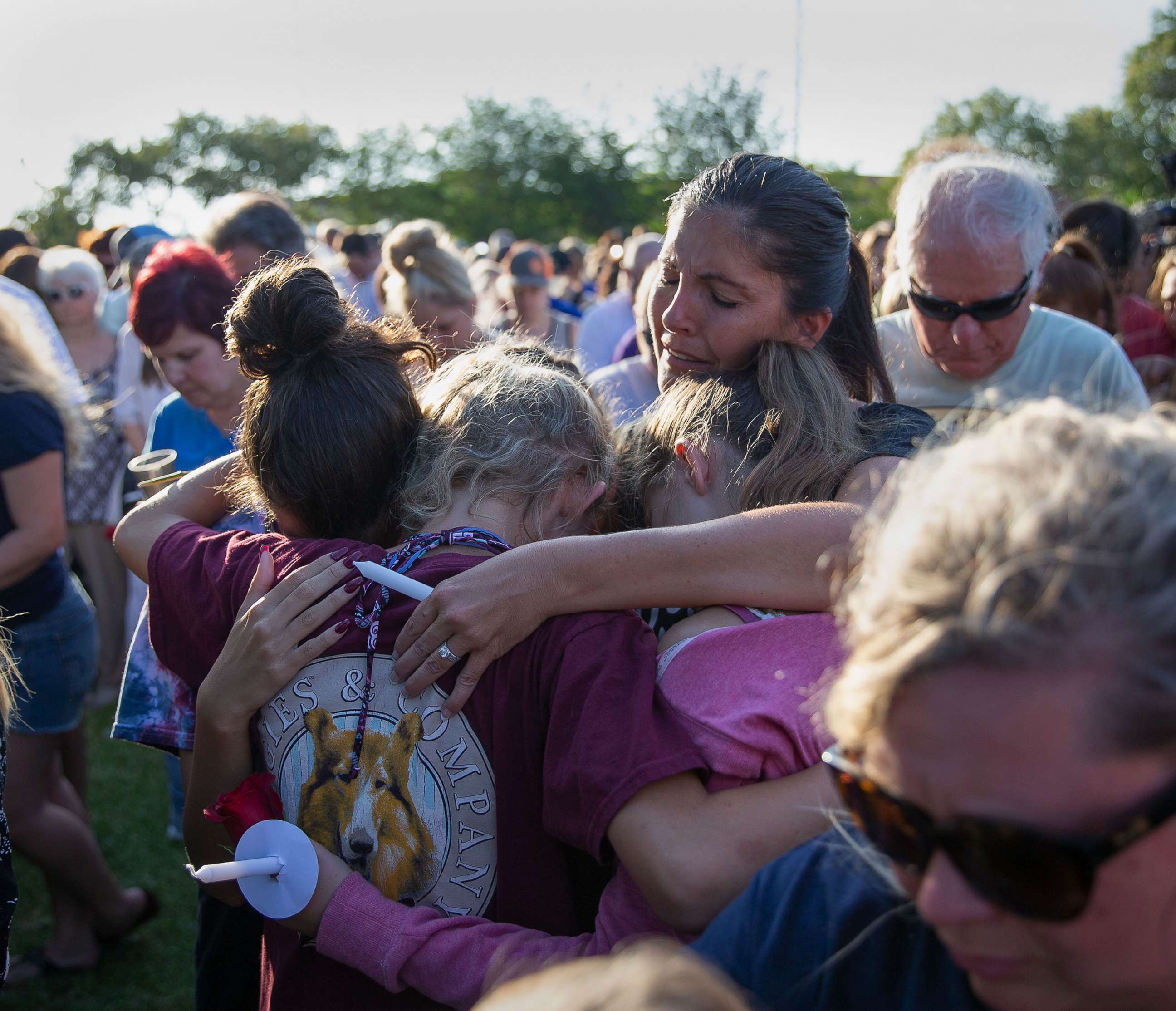PHOTO: Friends and family attend a vigil held at the First Bank in Santa Fe for the victims of a shooting incident at Santa Fe High School, May 18, 2018 in Santa Fe, Texas.